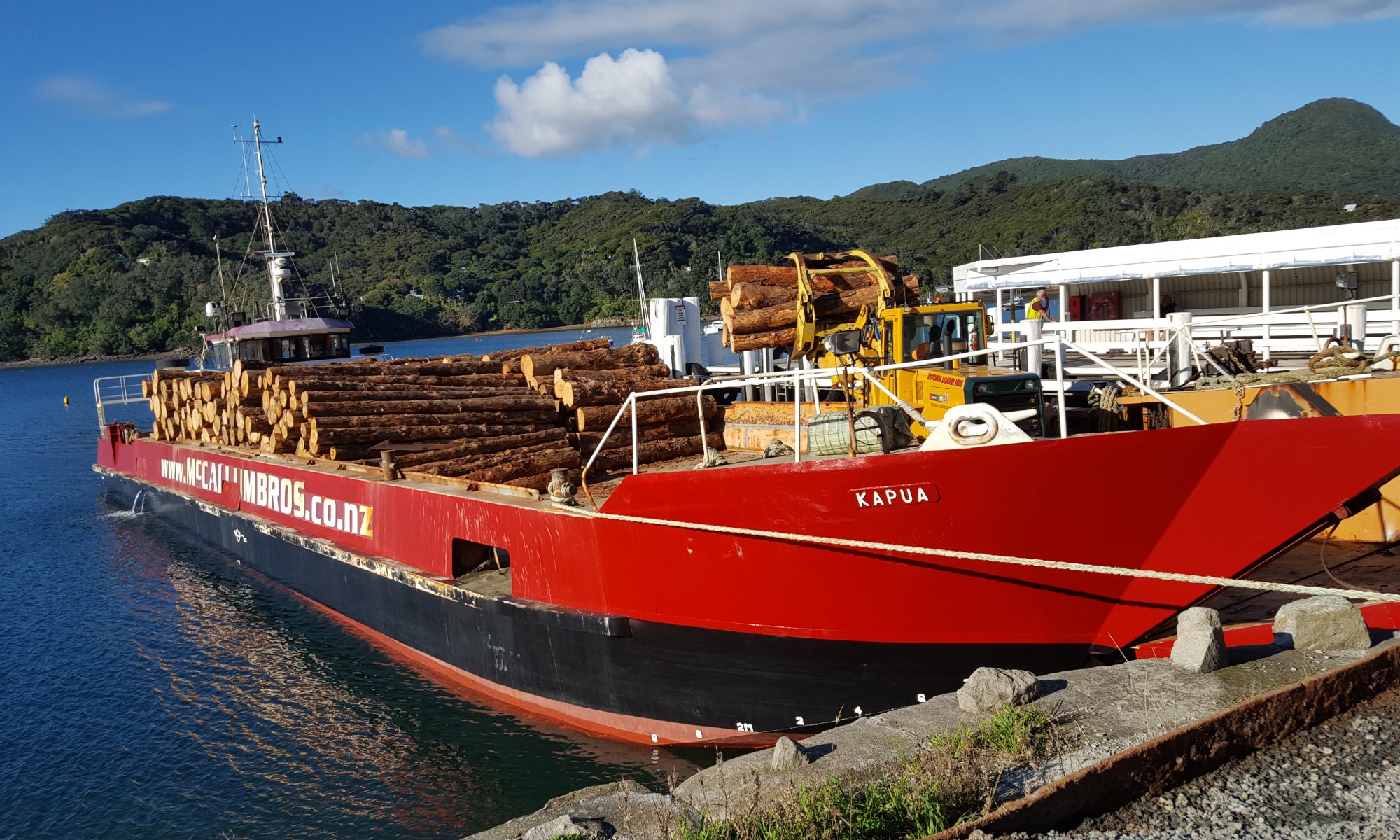 Kapua motorised barge contract transport of logs in Haurake Gulf